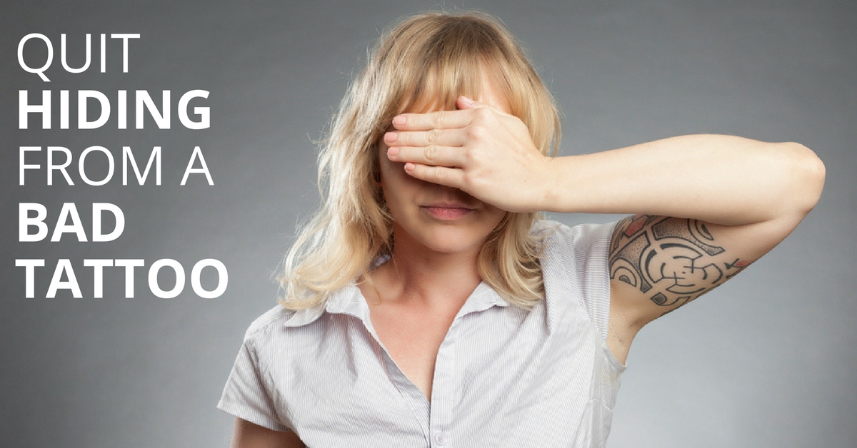 woman covering her eyes hiding from a bad tattoo she wants to remove