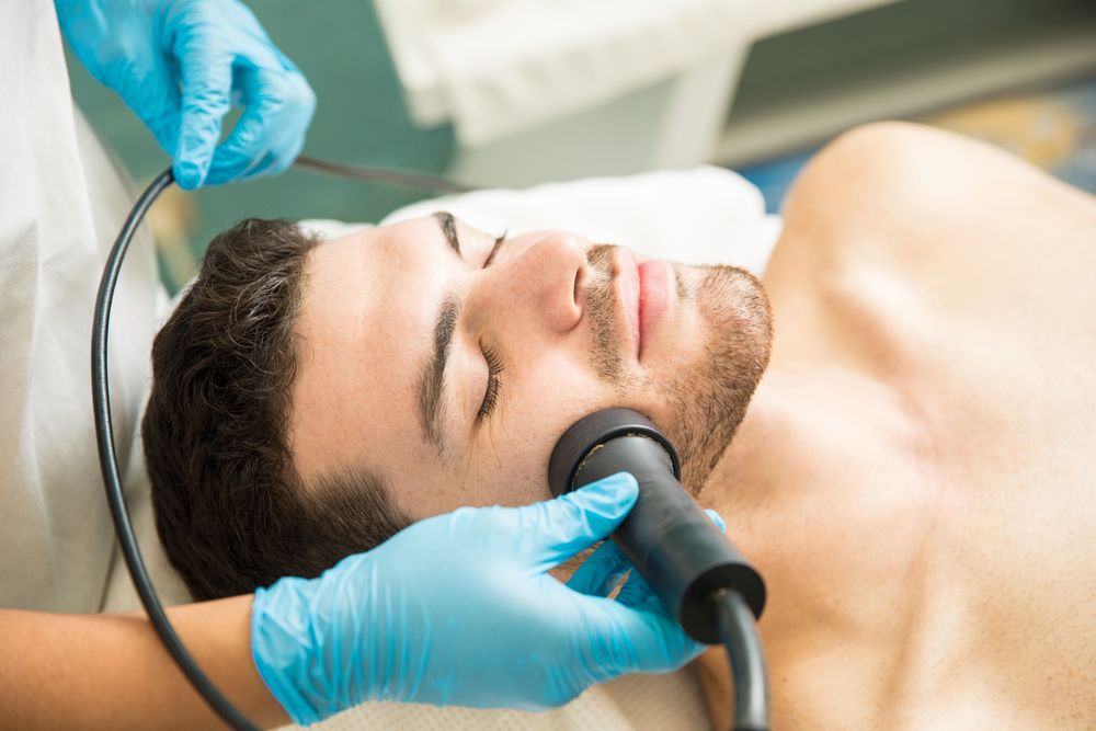 man receiving Facial rejuvenation therapy 